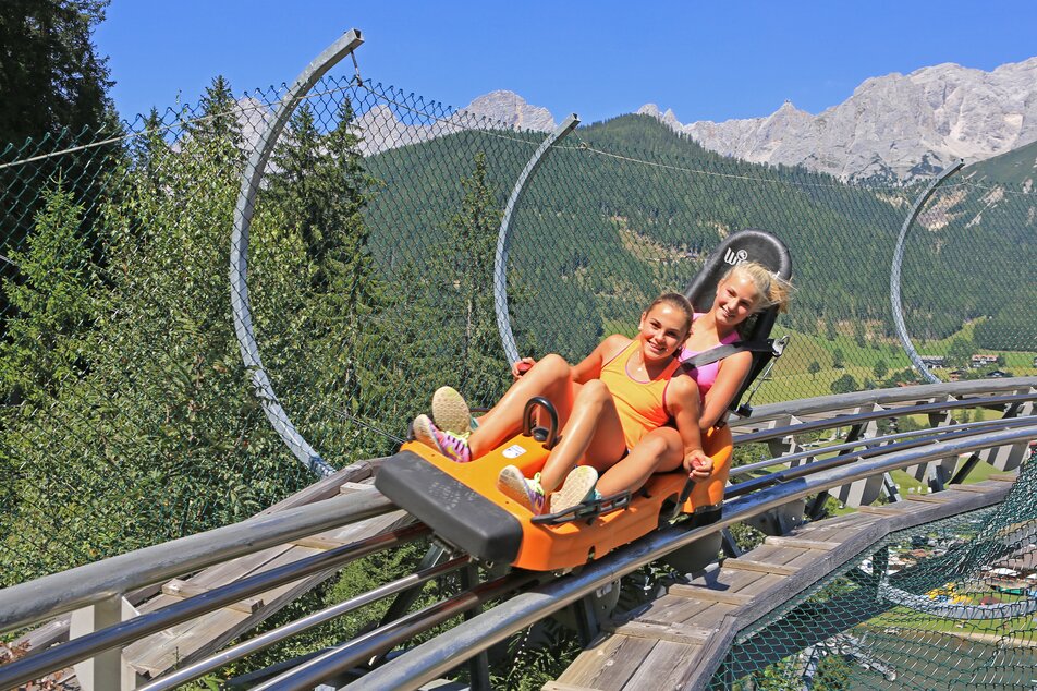 Two kids on the summer toboggan run Rittersberg | © Erlebnis Rittisberg